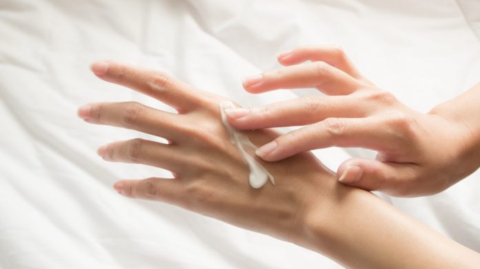cropped_image_of_woman_applying_cream_at_home-1620x911