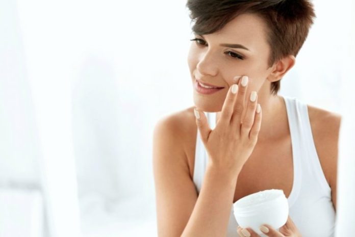 Beauty-Skin-Care.-Beautiful-Happy-Woman-Applying-Cosmetic-Cream-On-Clean-Face.-e1548451696235