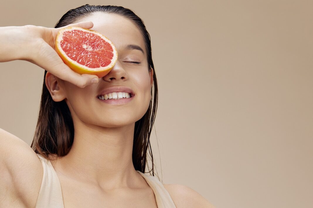 young woman grapefruit vitamins health cosmetology isolated background